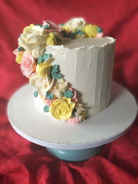 Cascading buttercream florals cake